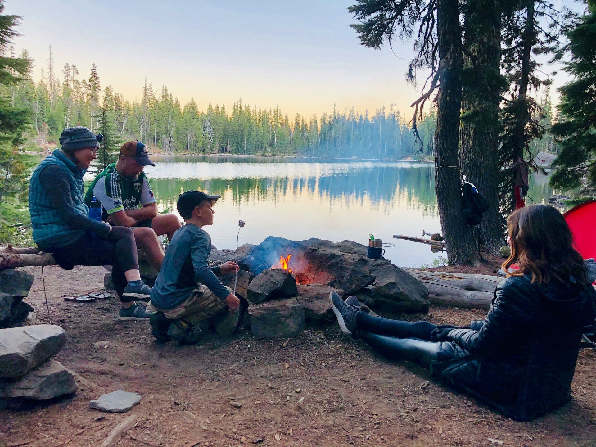 Camping scene with tent and gear in the wilderness